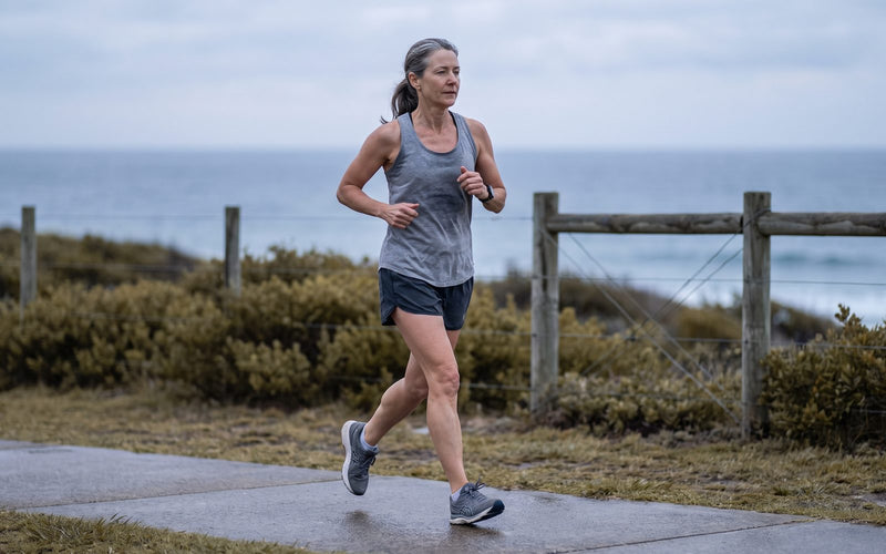 Woman in her fifties running on a coastal path on the New South Wales Central Coast